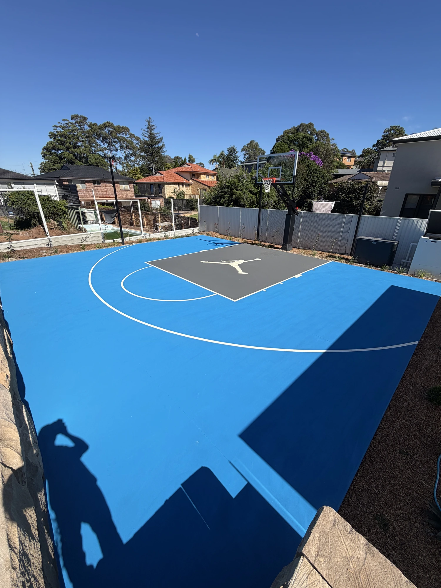Backyard Jordan court by Speedy Resurfacing