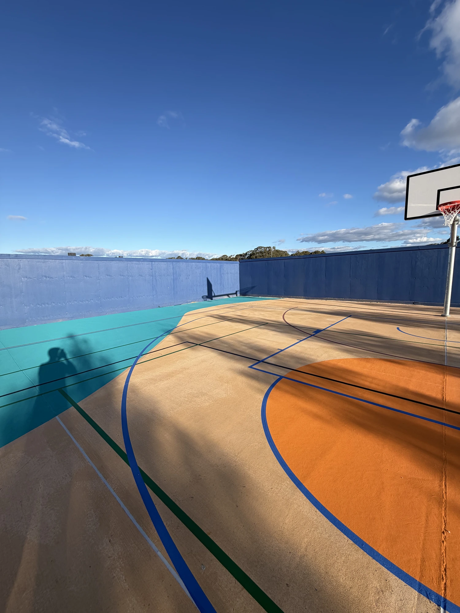 Court resurfacing by Team Speedy — fresh surface at golden hour